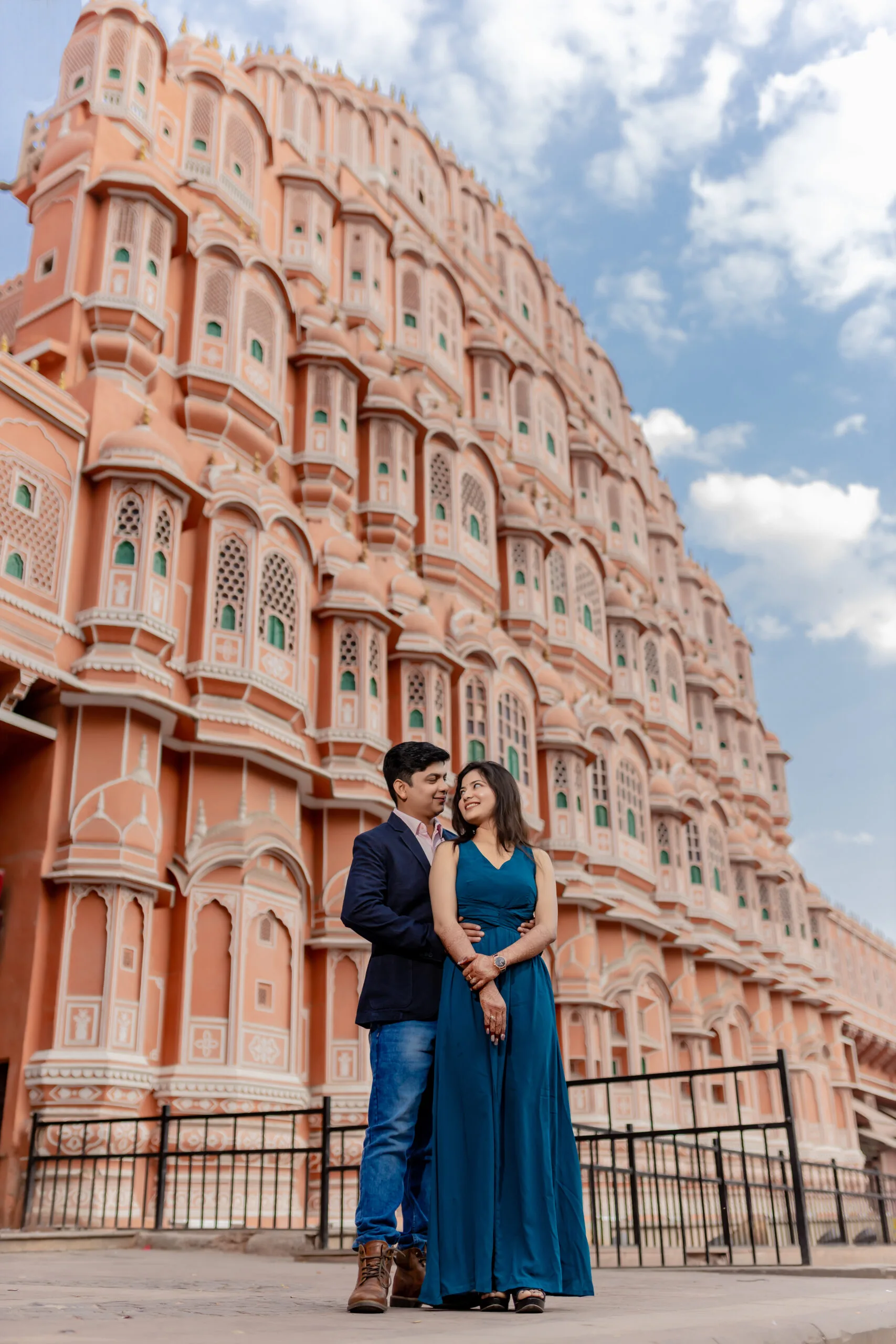A couple posing in front of the historic Hawa Mahal during their Pre Wedding Shoot in jaipur.