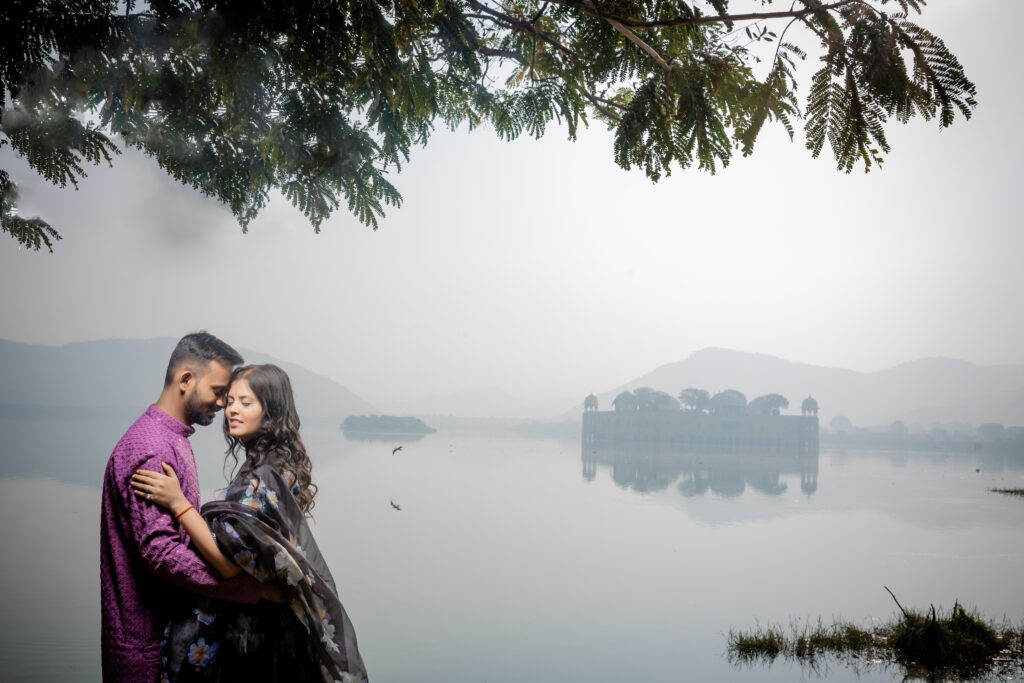 Pre Wedding Shoot Locations in Jaipur A professional pre-wedding shoot taking place at a prominent location in Jaipur, such as the Amer Fort or Patrika Gate, featuring a couple in traditional attire against historical Rajasthani architecture.