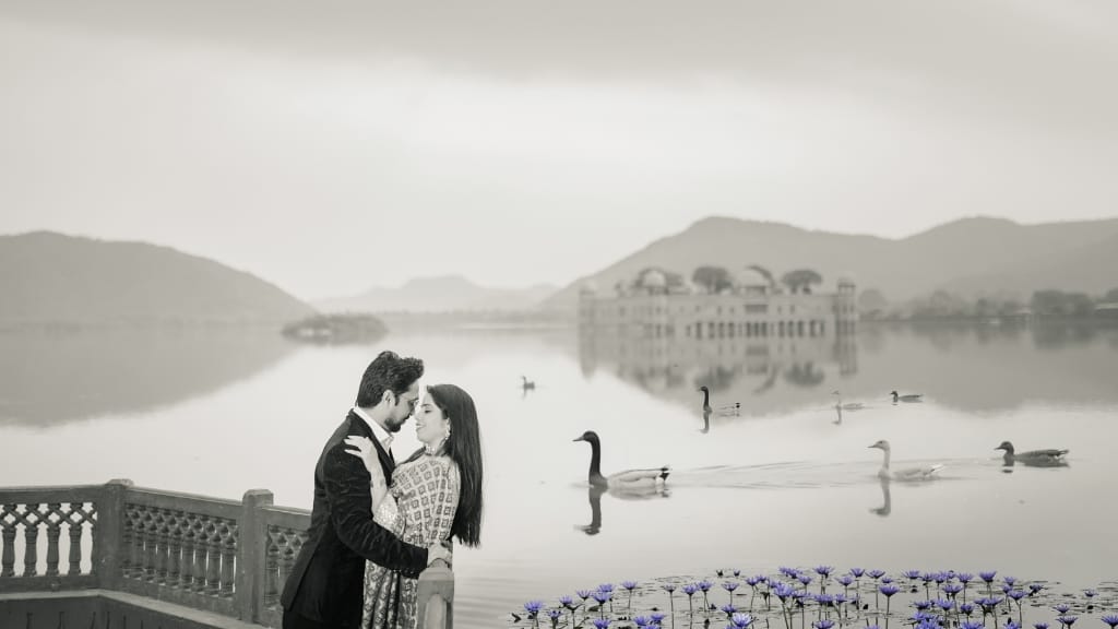 Romantic couple photography at Jal Mahal lakeside, one of the best Pre Wedding Shoot Locations in Jaipur