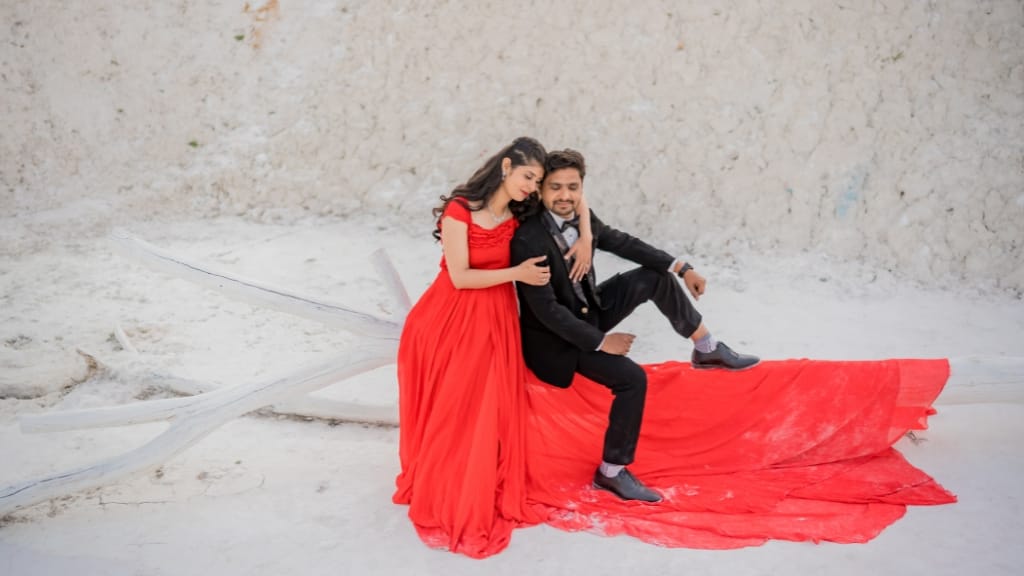 Stunning couple photoshoot in red dress at Kishangarh Dumping Yard, one of the trending Pre Wedding Shoot Locations in Jaipur