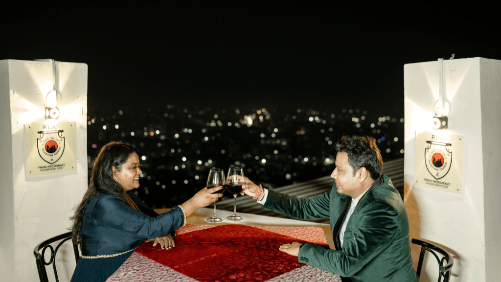 Night pre wedding photoshoot with city lights at Nahargarh Fort, one of the best Pre Wedding Shoot Locations in Jaipur